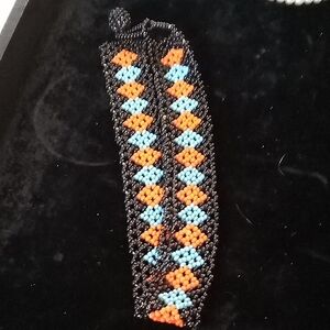Handmade Beaded Bracelet — Black with Orange & Light Blue Diamond Pattern